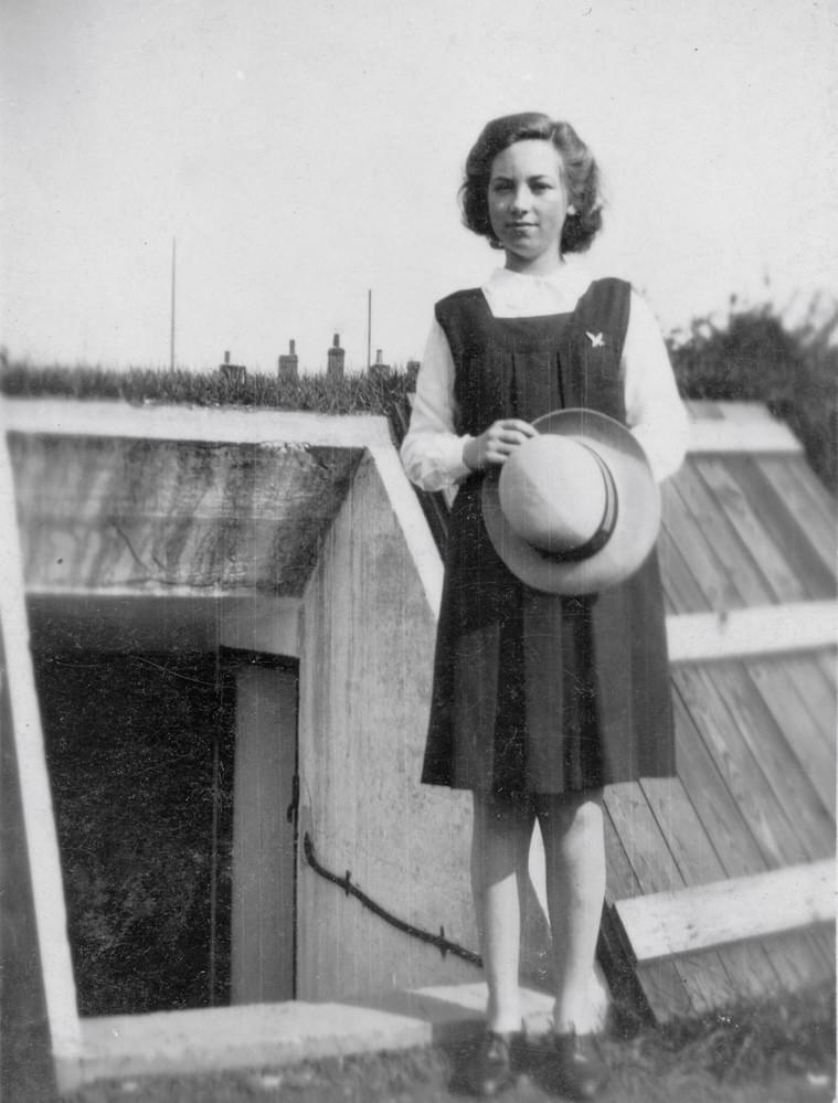 Barbara Sparkes (15) who lived at 2 Factory Terrace, standing at the entrance to a newly constructed shelter in 1939 (Malcolm Root)